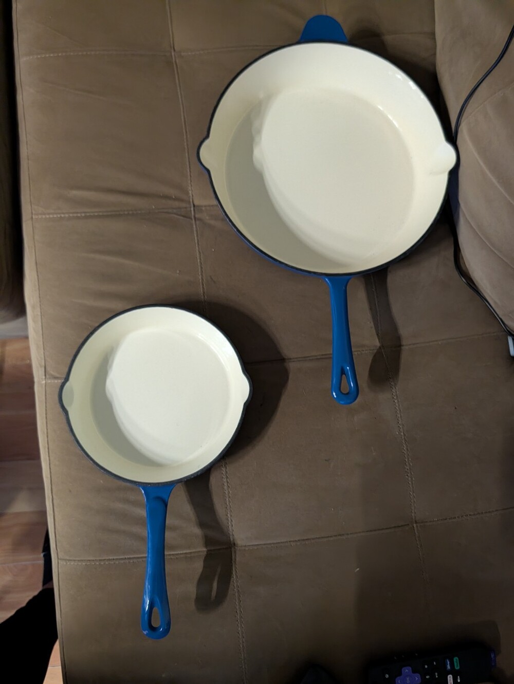 Blue enameled cast iron fry pan with a cream Colored Interior. Heavy
